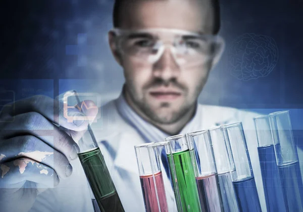 Young scientist mixing reagents Stock Image