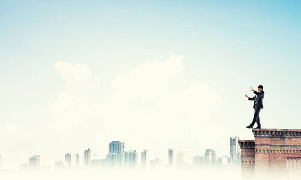 Businessman with blindfolder on eyes 