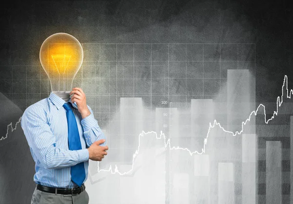 Businessman with lamp head — Stock Photo, Image