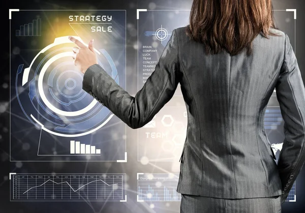 Businesswoman working with virtual panel interface — Stock Photo, Image