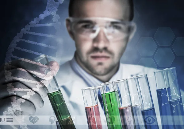 Young scientist mixing reagents — Stock Photo, Image