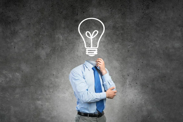 Businessman with lamp head Royalty Free Stock Photos