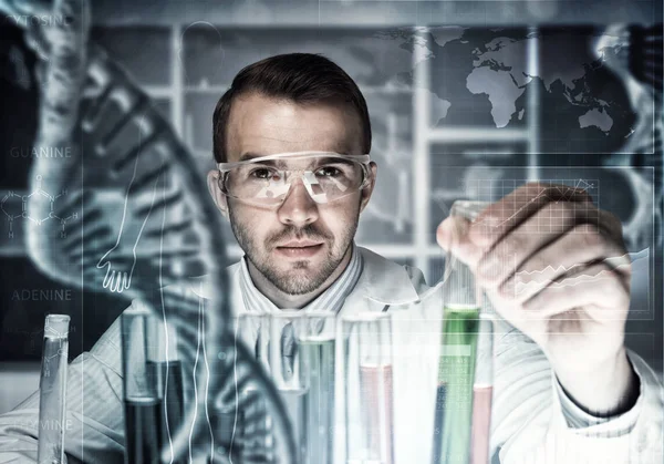 Young scientist mixing reagents — Stock Photo, Image