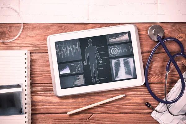 White tablet pc and doctor tools — Stock Photo, Image