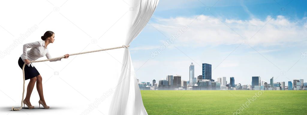 Businesswoman pulling white curtain 