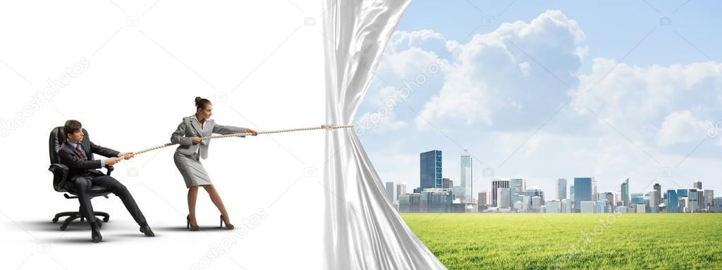  businesspeople pulling fabric with rope