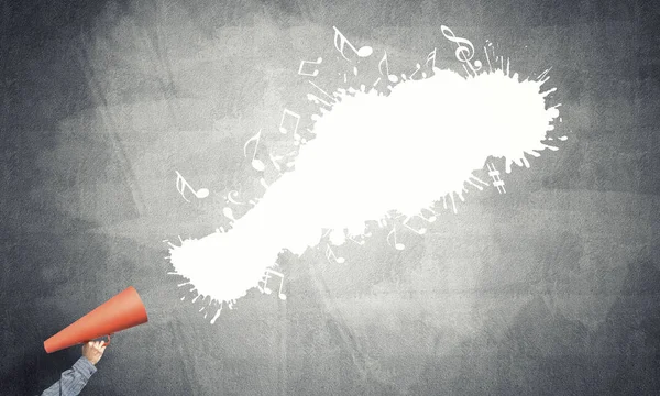 Man making announcement in paper trumpet — Stock Photo, Image