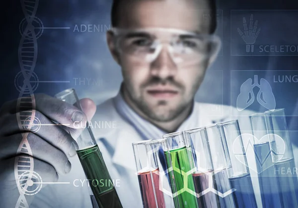 Young scientist mixing reagents — Stock Photo, Image