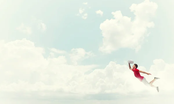 Man flying high in sky — Stock Photo, Image