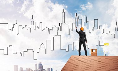 Adam mimar modern şehir silüeti çizmek 