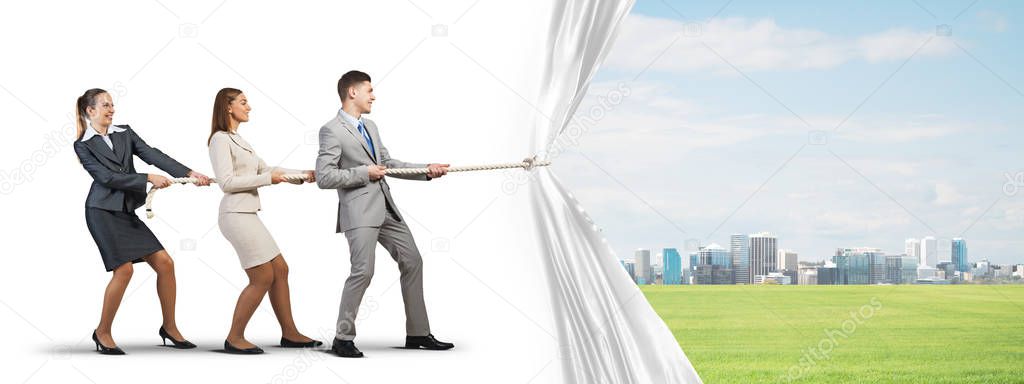 businesspeople pulling white fabric