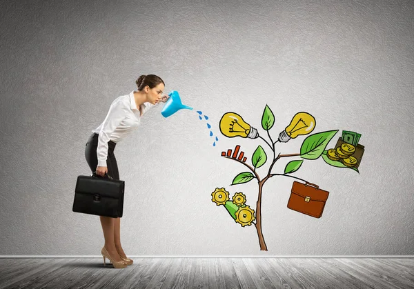 Businesswoman watering drawn growth concept — Stock Photo, Image