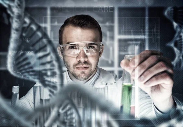 Young scientist mixing reagents — Stock Photo, Image