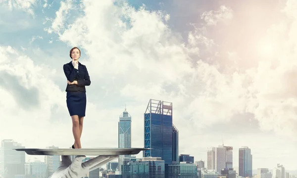 Business woman standing on tray — стоковое фото