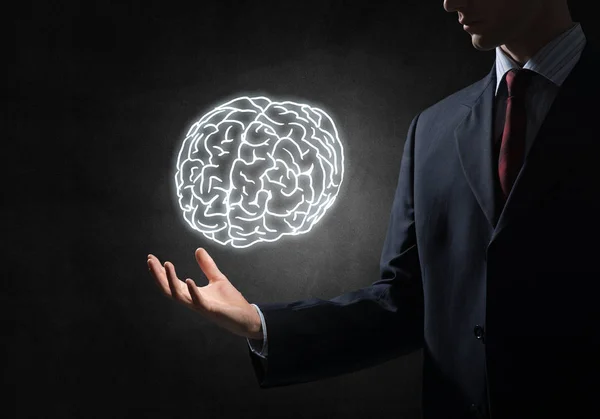 Businessman hand holding brain — Stock Photo, Image