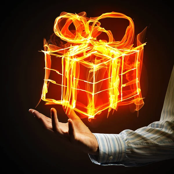 Glowing gift box icon with palm — Stock Photo, Image