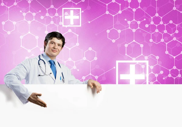 Doctor holding white blank banner — Stock Photo, Image