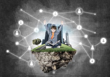 kitap yüzen ada üzerinde oturan çocukla 