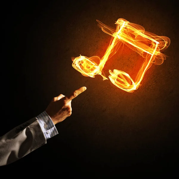 Hand and fire music symbol — Stock Photo, Image