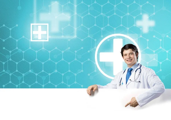 Doctor holding white blank banner — Stock Photo, Image