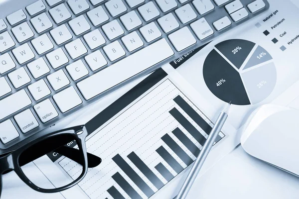 Business workplace with keyboard and glasses — Stock Photo, Image