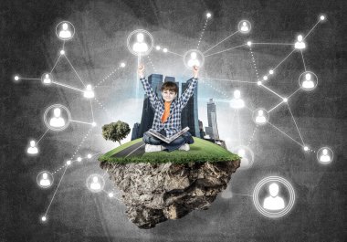 kitap yüzen ada üzerinde oturan çocukla 