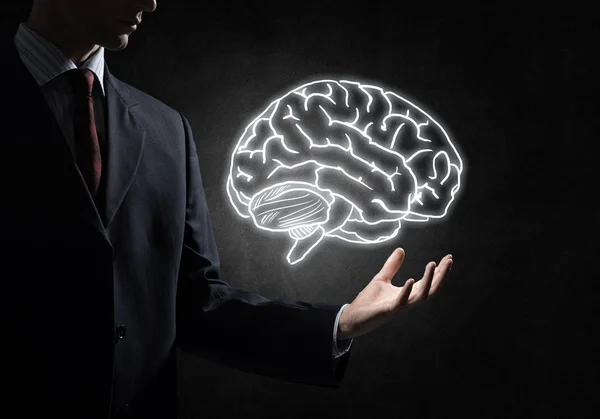 Businessman hand holding brain sketch — Stock Photo, Image