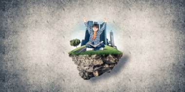 yüzen ada üzerinde oturan çocuk