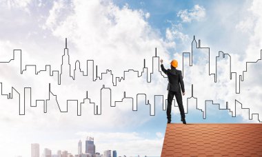 adam evin çatı ve çizim şehir