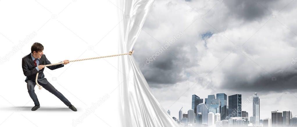 Businessman pulling white blank fabric