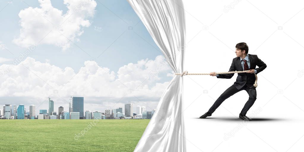 Businessman pulling white blank fabric