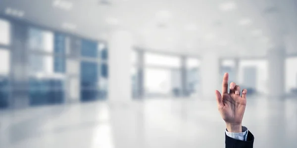 Business woman hand touching screen — стоковое фото