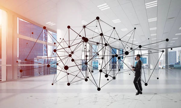 Businessman in modern office interior — Stock Photo, Image