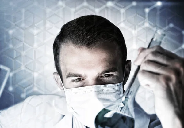 Young scientist mixing reagents — Stock Photo, Image