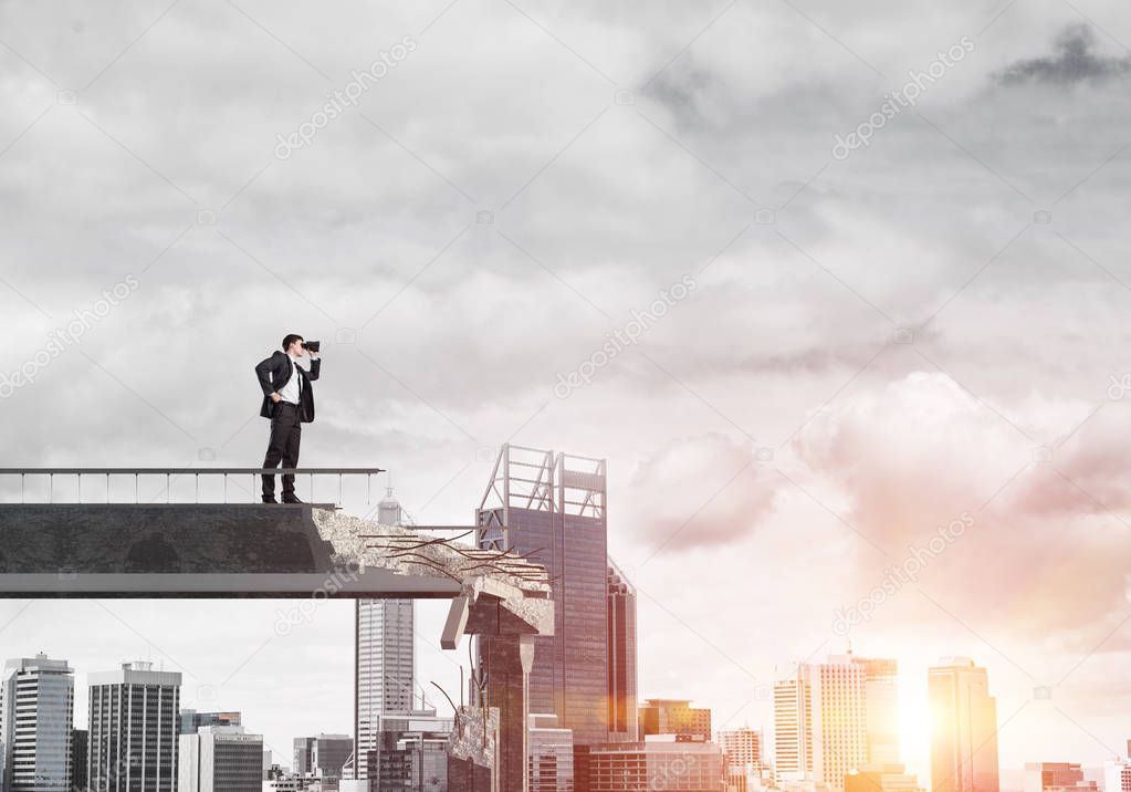 Businessman in suit looking in binoculars while standing on broken bridge with cityscape and sunlight on background. 3D rendering.