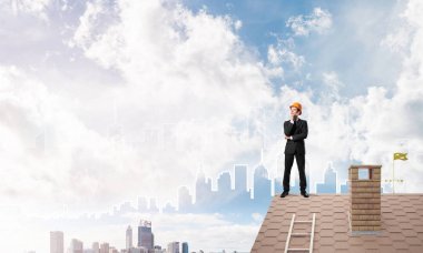 businessman standing on roof edge  clipart