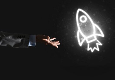 Roket parlayan simgesi ve işadamı el