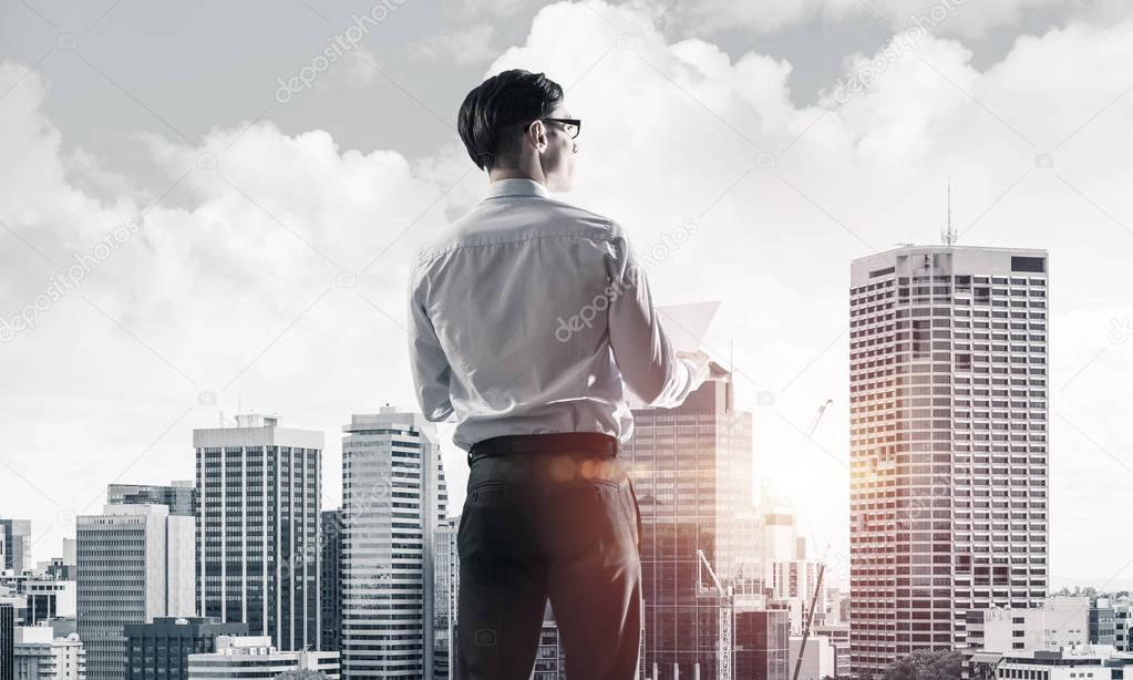 Businessman looking at modern business center