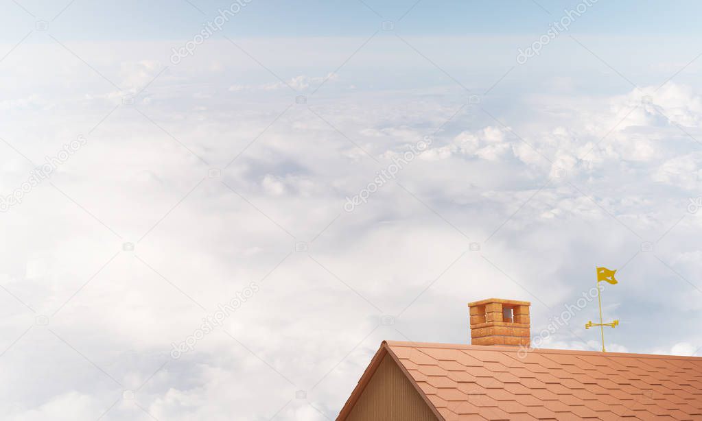 Brown brick roof with chimney against blue sky background. Mixed media