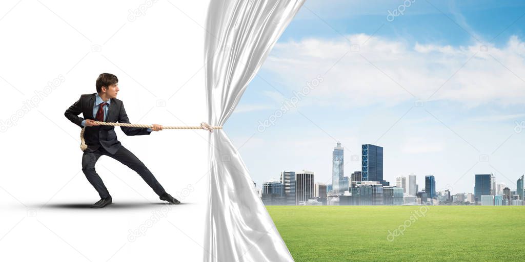 Businessman pulling white blank fabric