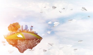 Kule ve gökdelen yeşil arazi parçası üzerinde ile modern cityscape