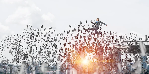 Businessman jumping over gap with flying letters in concrete bridge as symbol of overcoming challenges with cityscape on background, 3D rendering