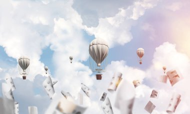 Renkli aerostats kağıt belgeler arasında ve mavi bulutlu gökyüzü üzerinde uçan. 3D render.