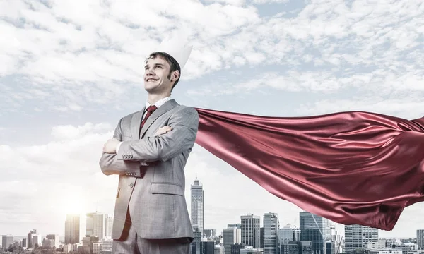 Businessman wearing red cape — Stock Photo, Image