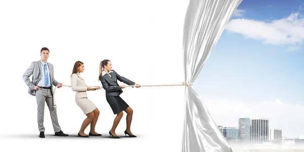 Business people pulling white blank — Stock Photo, Image
