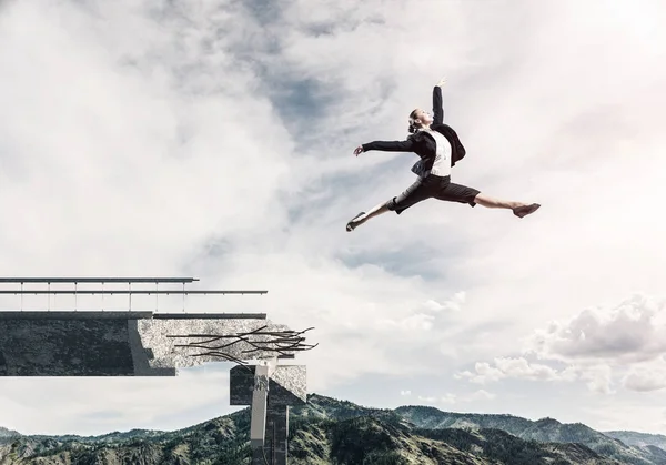 Business woman jumping over huge gap in concrete bridge as symbol of overcoming challenges with cityscape on background, 3D rendering