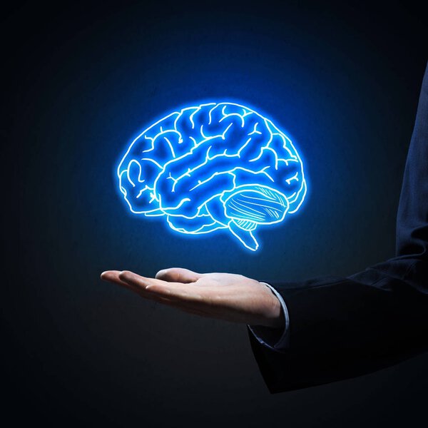 business man hand holding brain in palm
