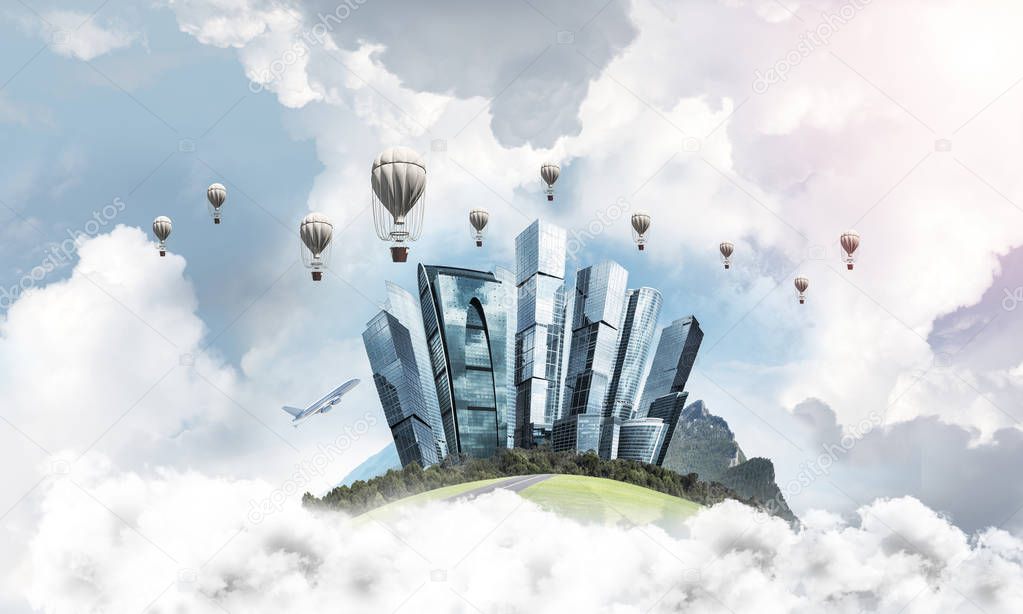 Green flying island among clouds with urban view of towers and skyscrapers. Flying aerostates and blue cloudy skyscape on background.