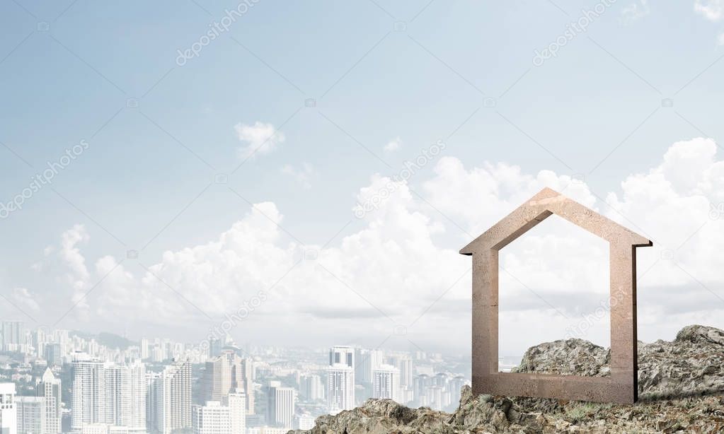 House stone figure as symbol of construction and real estate outdoors