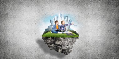 kitap üzerinde yüzen ada, eko kavramı oturan çocuklarla